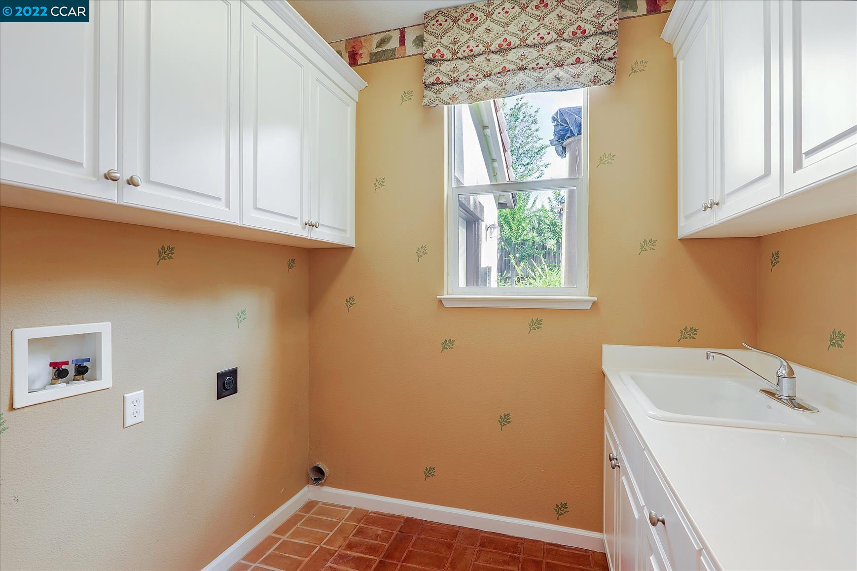 109 Elegans Court San Ramon, CA 94582 - Photo 33 of 41 a view of a utility room with a window dryer and washer