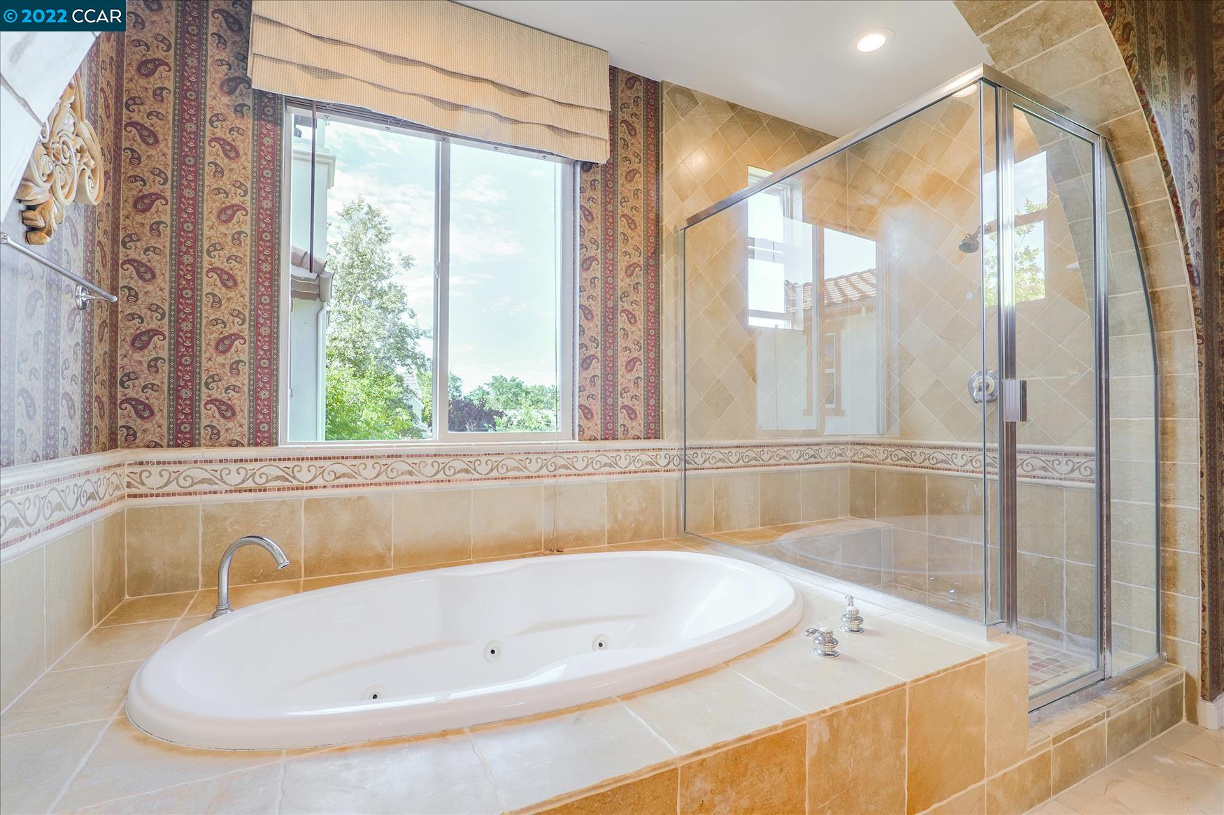 109 Elegans Court San Ramon, CA 94582 - Photo 38 of 41 a bathroom with a bathtub and shower