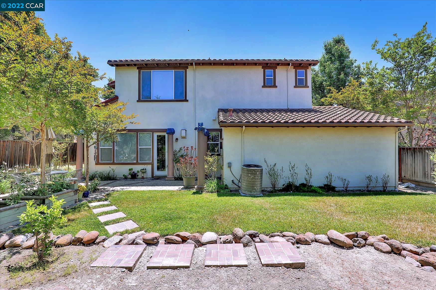 109 Elegans Court San Ramon, CA 94582 - Photo 6 of 41 a front view of a house with a yard and garage
