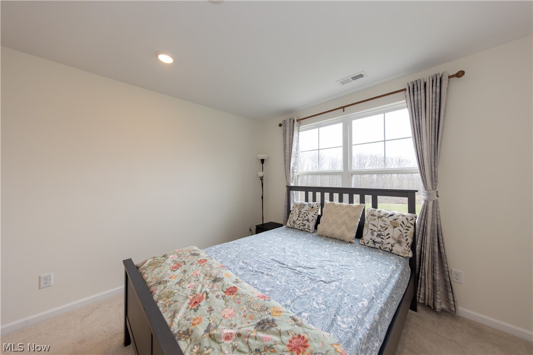 766 River Run Road Aurora, OH 44202 - Photo 33 of 49 Primary Bedroom featuring light colored carpet and recessed lighting