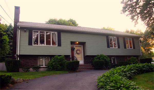 133 Spring Street Stoneham, MA 02180 - Photo 1 of 20 a front view of a house with garden