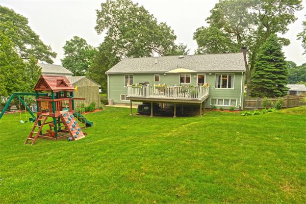 133 Spring Street Stoneham, MA 02180 - Photo 17 of 20 a front view of a house with garden