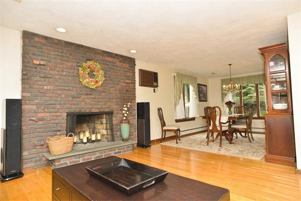133 Spring Street Stoneham, MA 02180 - Photo 4 of 20 a living room with furniture and a fireplace