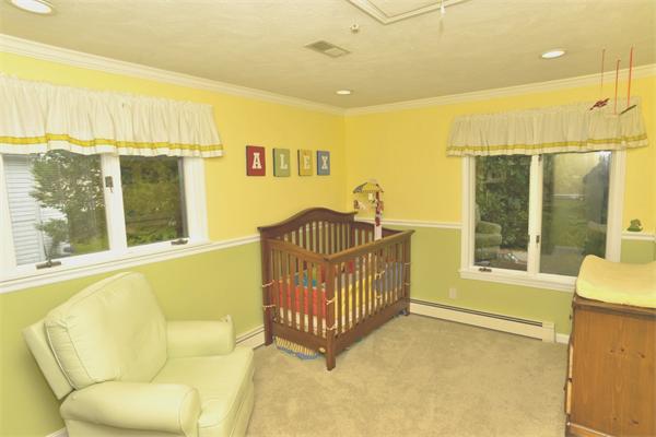 133 Spring Street Stoneham, MA 02180 - Photo 8 of 20 a view of a bedroom with furniture window and outside view