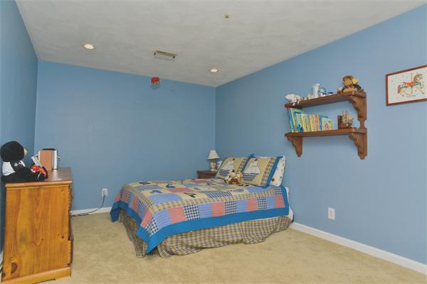 133 Spring Street Stoneham, MA 02180 - Photo 9 of 20 a bedroom with bed and window