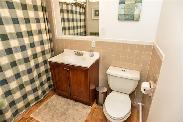 133 Spring Street Stoneham, MA 02180 - Photo 10 of 20 a bathroom with a sink toilet and shower