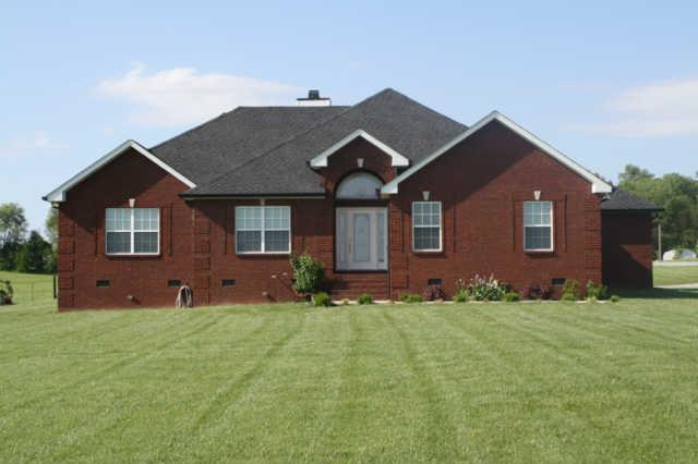 8448 North Pinson Road Portland, TN 37148 - Photo 1 of 20 a front view of a house with a yard