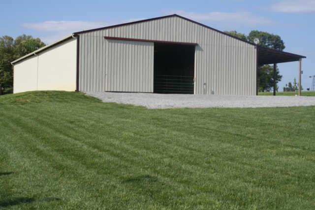 8448 North Pinson Road Portland, TN 37148 - Photo 16 of 20 a front view of house with yard and garage