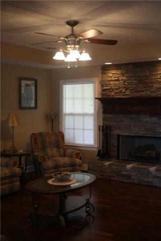 8448 North Pinson Road Portland, TN 37148 - Photo 6 of 20 a living room with furniture and a fireplace