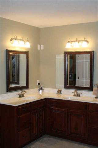 8448 North Pinson Road Portland, TN 37148 - Photo 8 of 20 a bathroom with a double vanity sink and a mirror