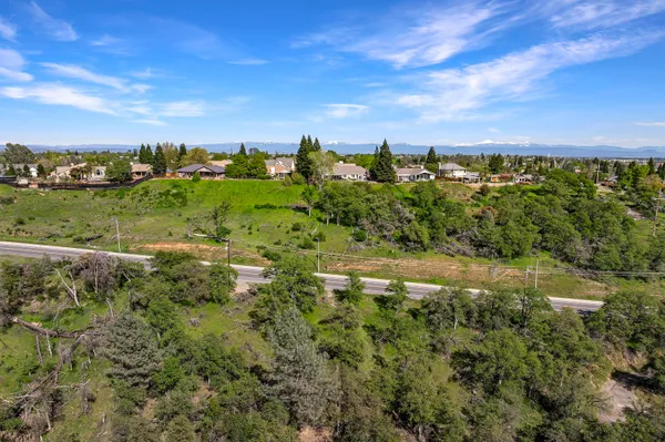 a view of a yard with an outdoor seating