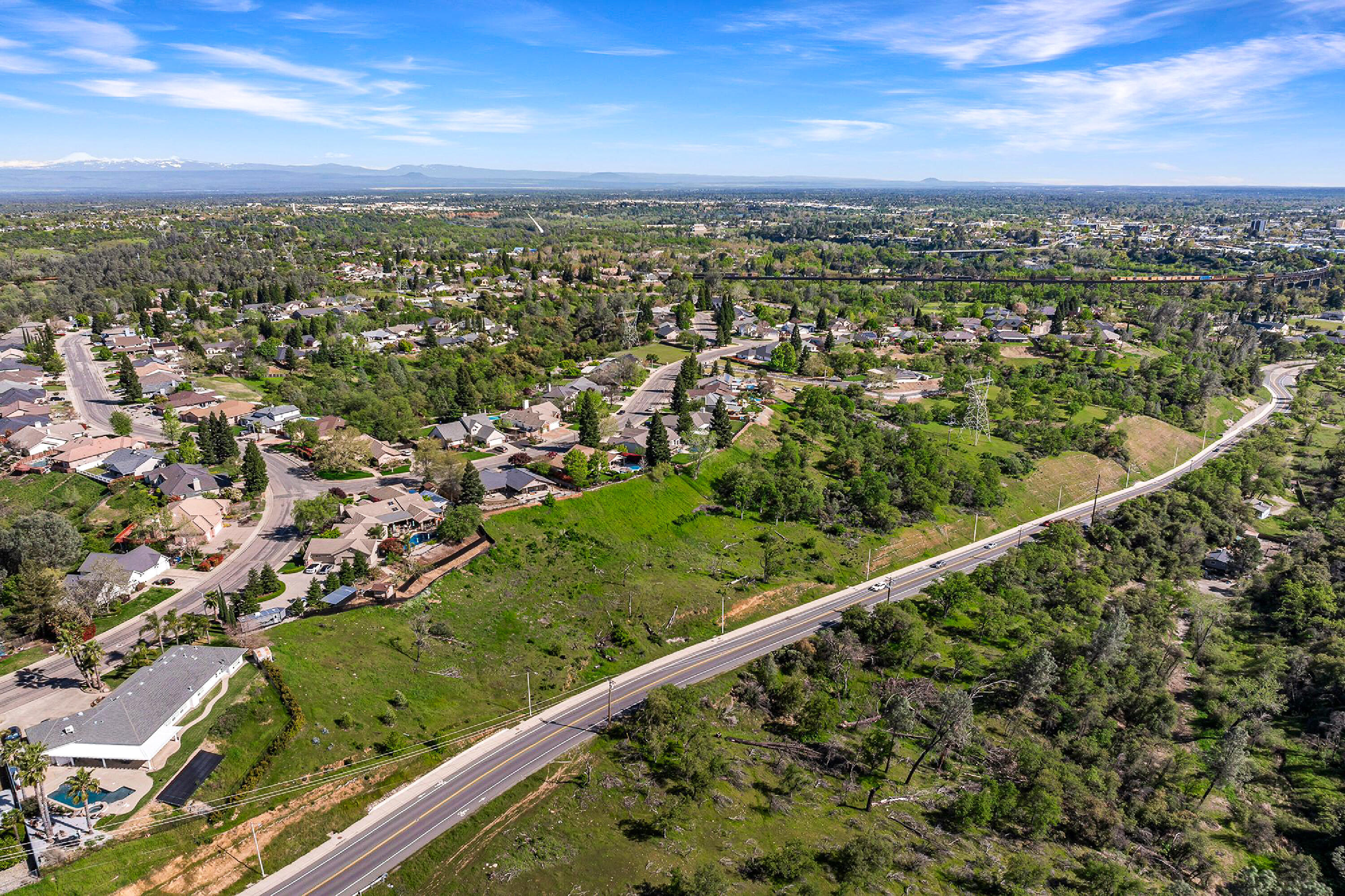 166 Quartz Hill Road Redding, CA 96003 - Photo 27 of 34 a view of a green field with a city view