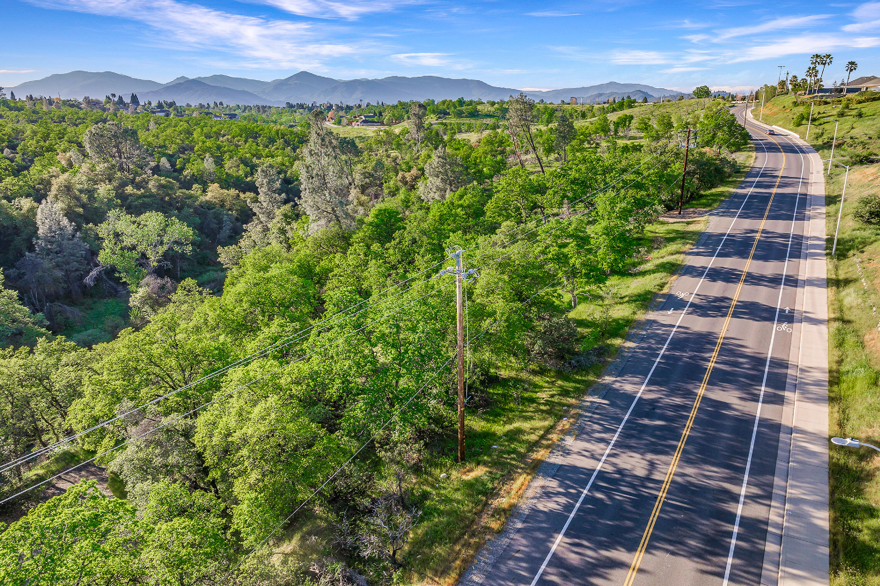 166 Quartz Hill Road Redding, CA 96003 - Photo 10 of 34 a view of a city with lush green forest