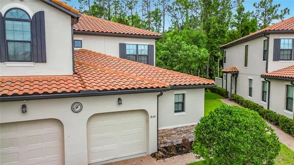 a front view of a house with garage