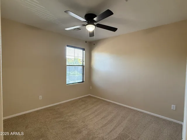 a bathroom with a sink a toilet a mirror and vanity