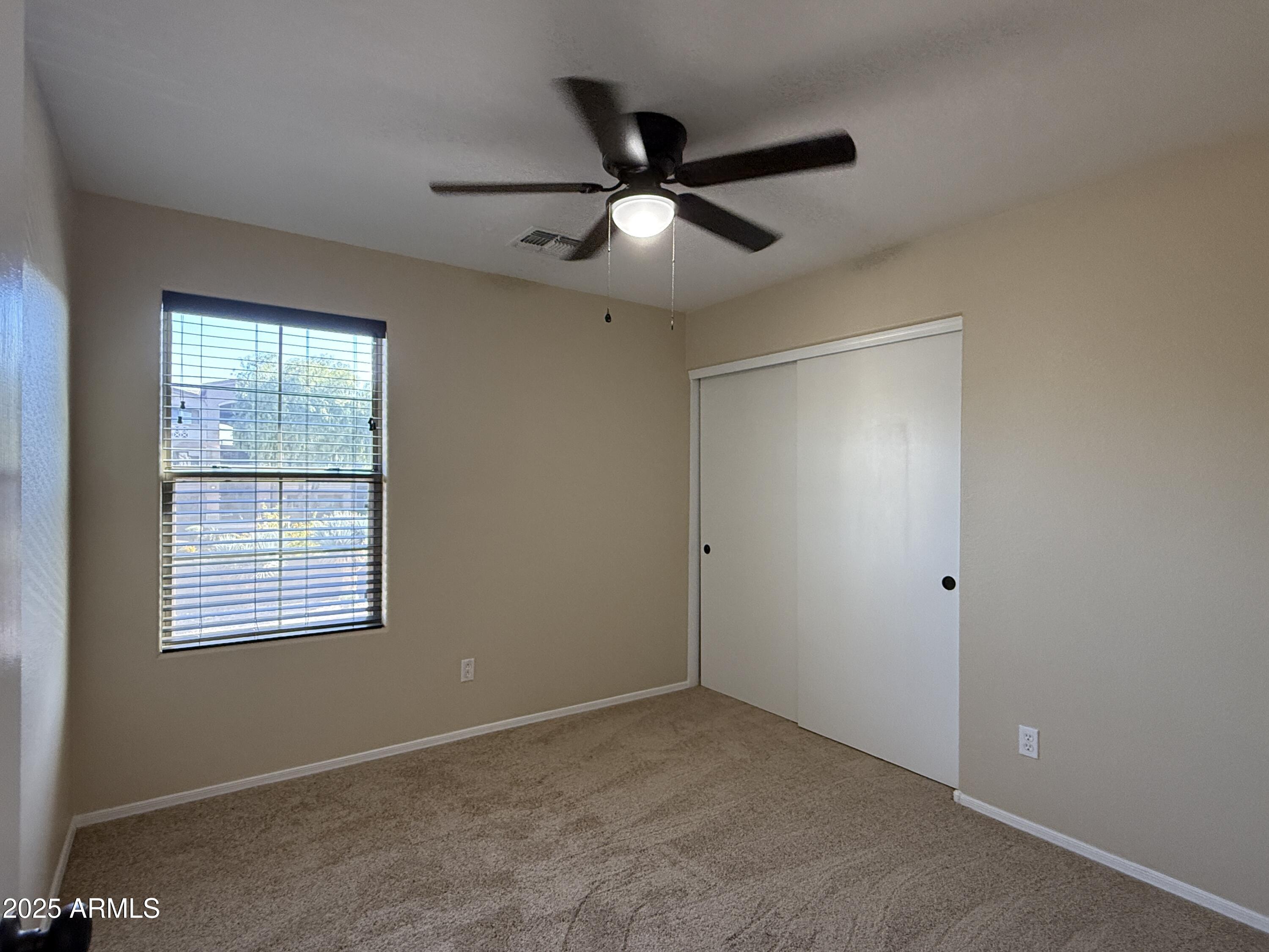 1265 South Aaron, Unit 277 Mesa, AZ 85209 - Photo 15 of 37 a view of an empty room with a window