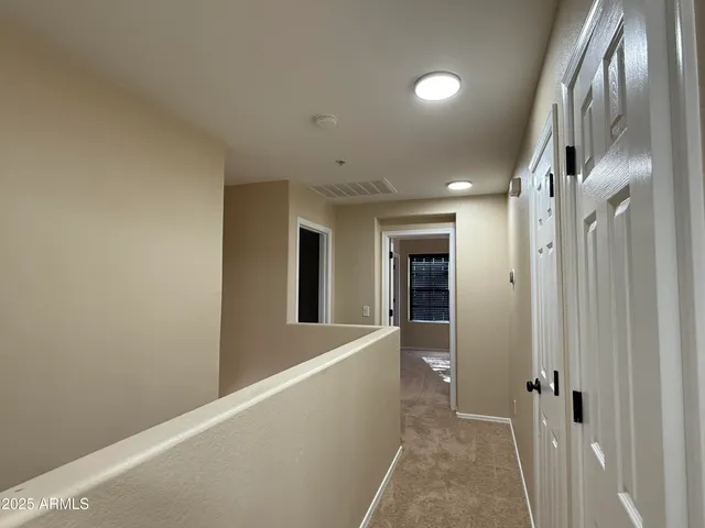 a view of a patio with table and chairs with wooden fence