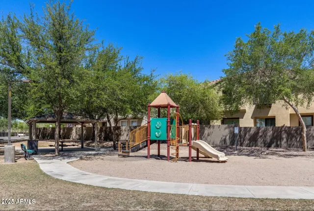 a view of a playground with basketball court