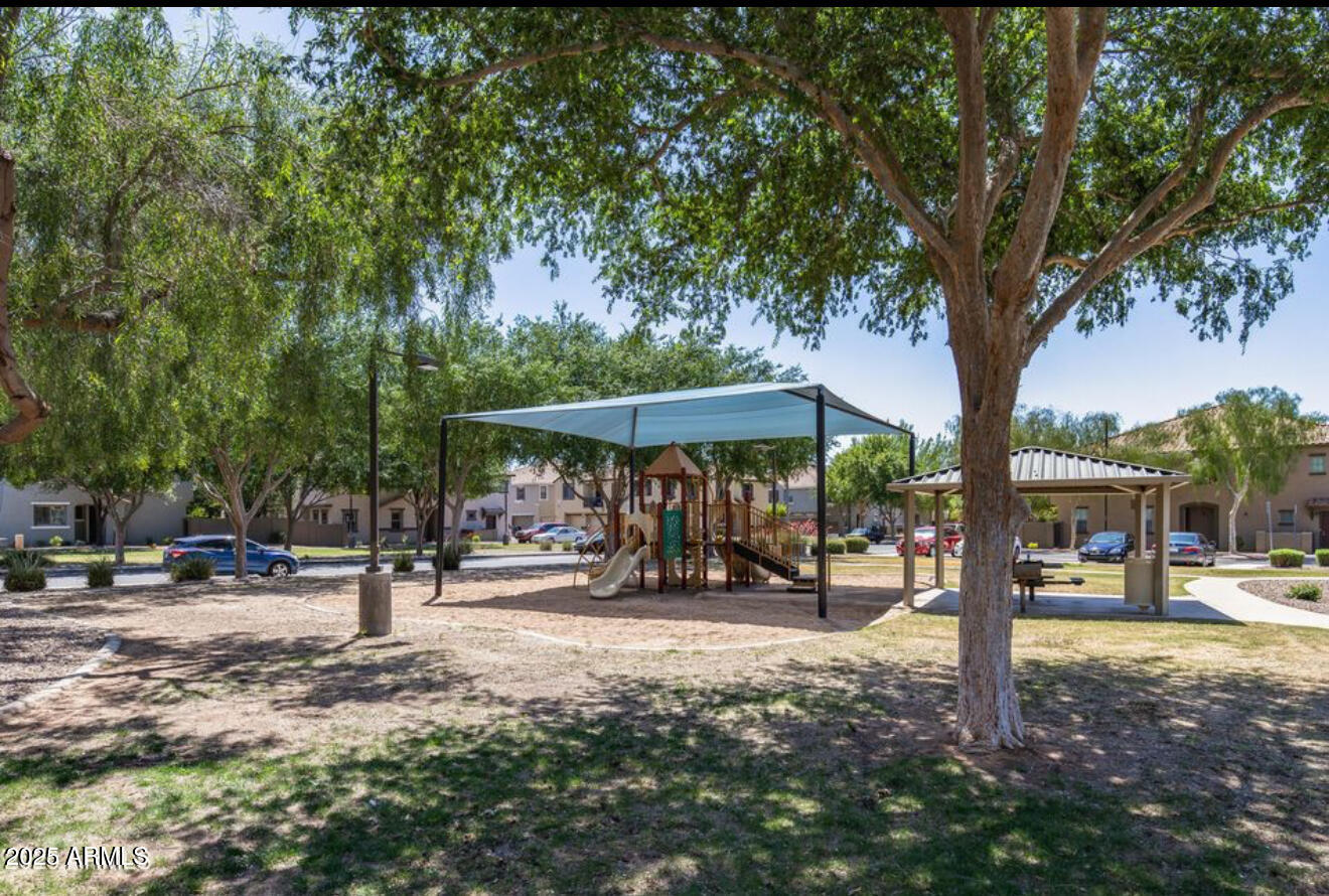 1265 South Aaron, Unit 277 Mesa, AZ 85209 - Photo 21 of 37 a view of a outdoor space with lots of swings and slides