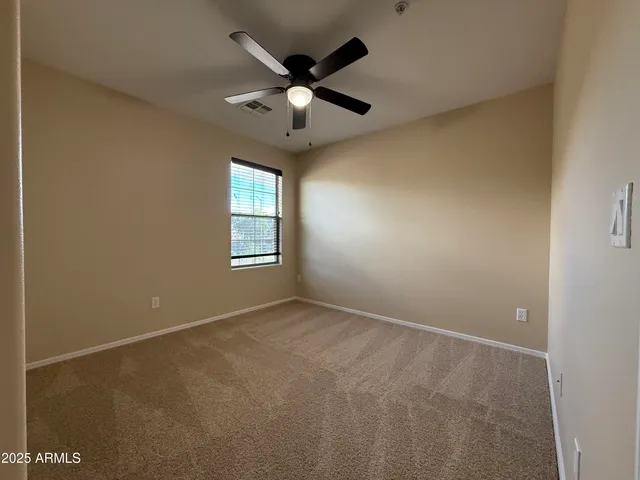a spacious bathroom with a tub sink shower and mirror