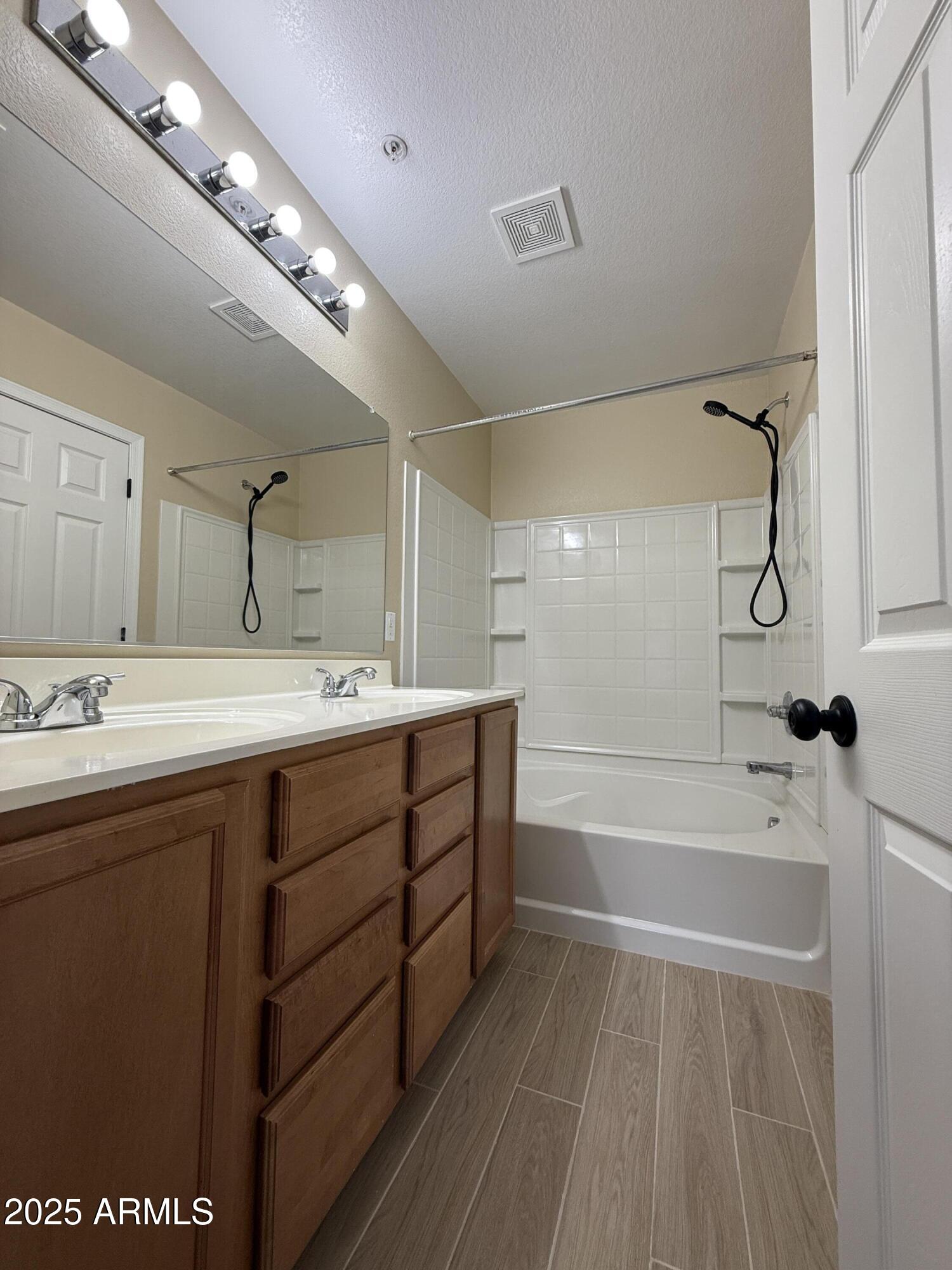 1265 South Aaron, Unit 277 Mesa, AZ 85209 - Photo 25 of 37 a spacious bathroom with a tub sink shower and mirror