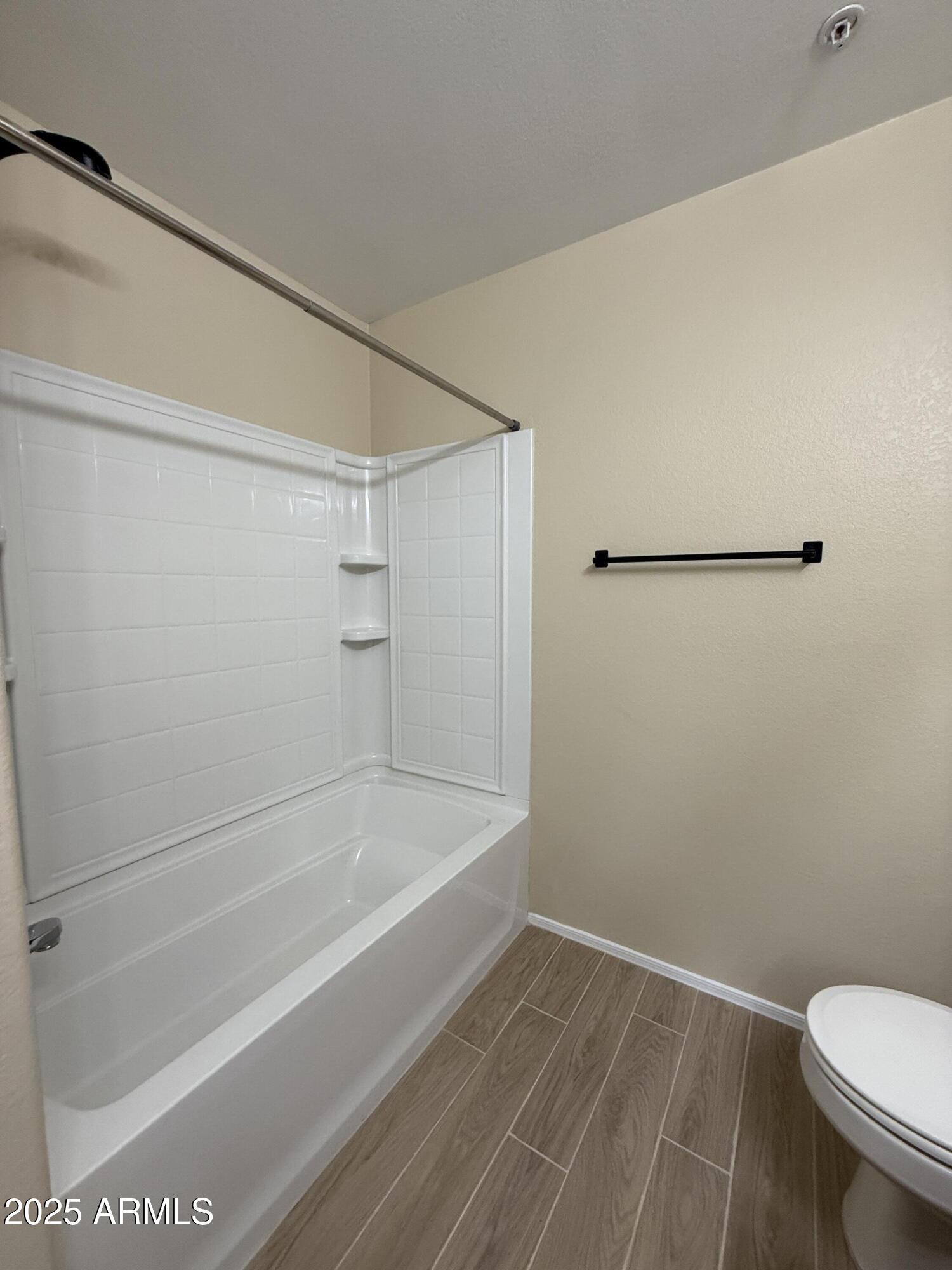 1265 South Aaron, Unit 277 Mesa, AZ 85209 - Photo 29 of 37 a bathroom with a shower and a toilet
