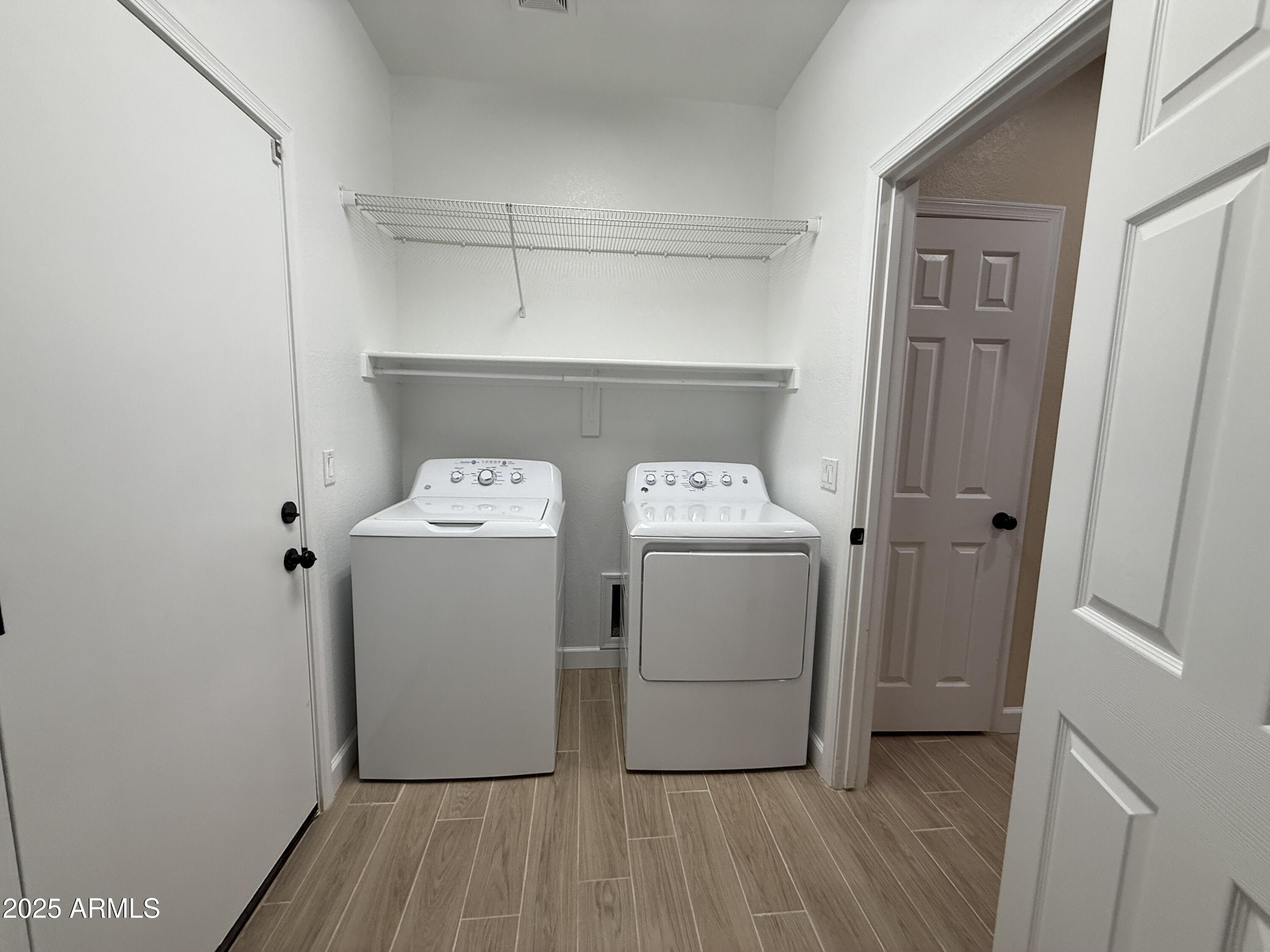 1265 South Aaron, Unit 277 Mesa, AZ 85209 - Photo 30 of 37 a utility room with dryer and washer