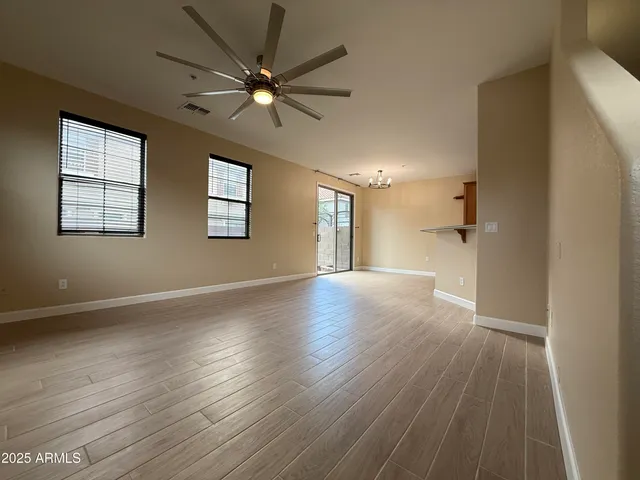 a kitchen with stainless steel appliances granite countertop a refrigerator sink and stove