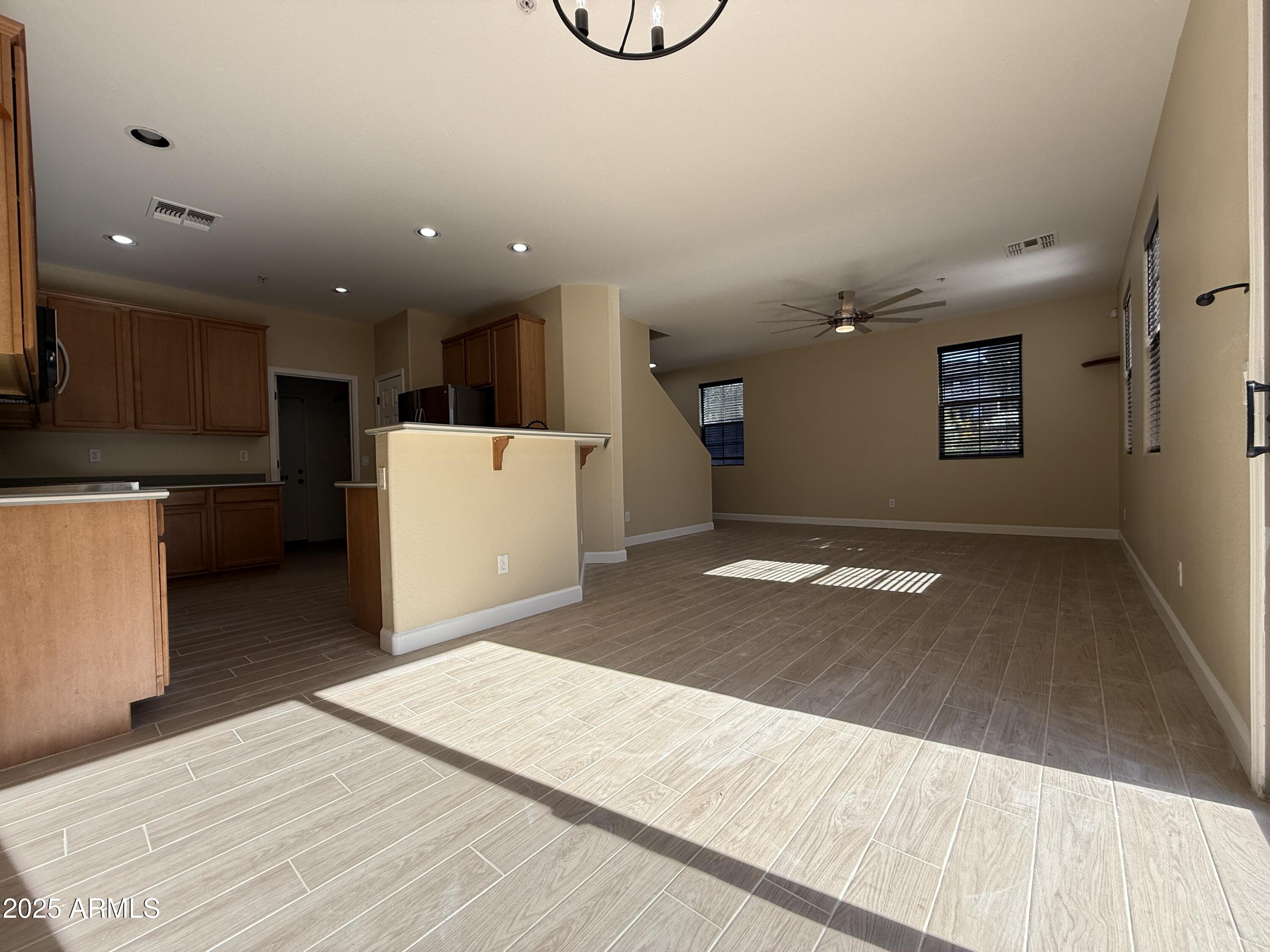 1265 South Aaron, Unit 277 Mesa, AZ 85209 - Photo 7 of 37 a view of a room with a kitchen and a dishwasher