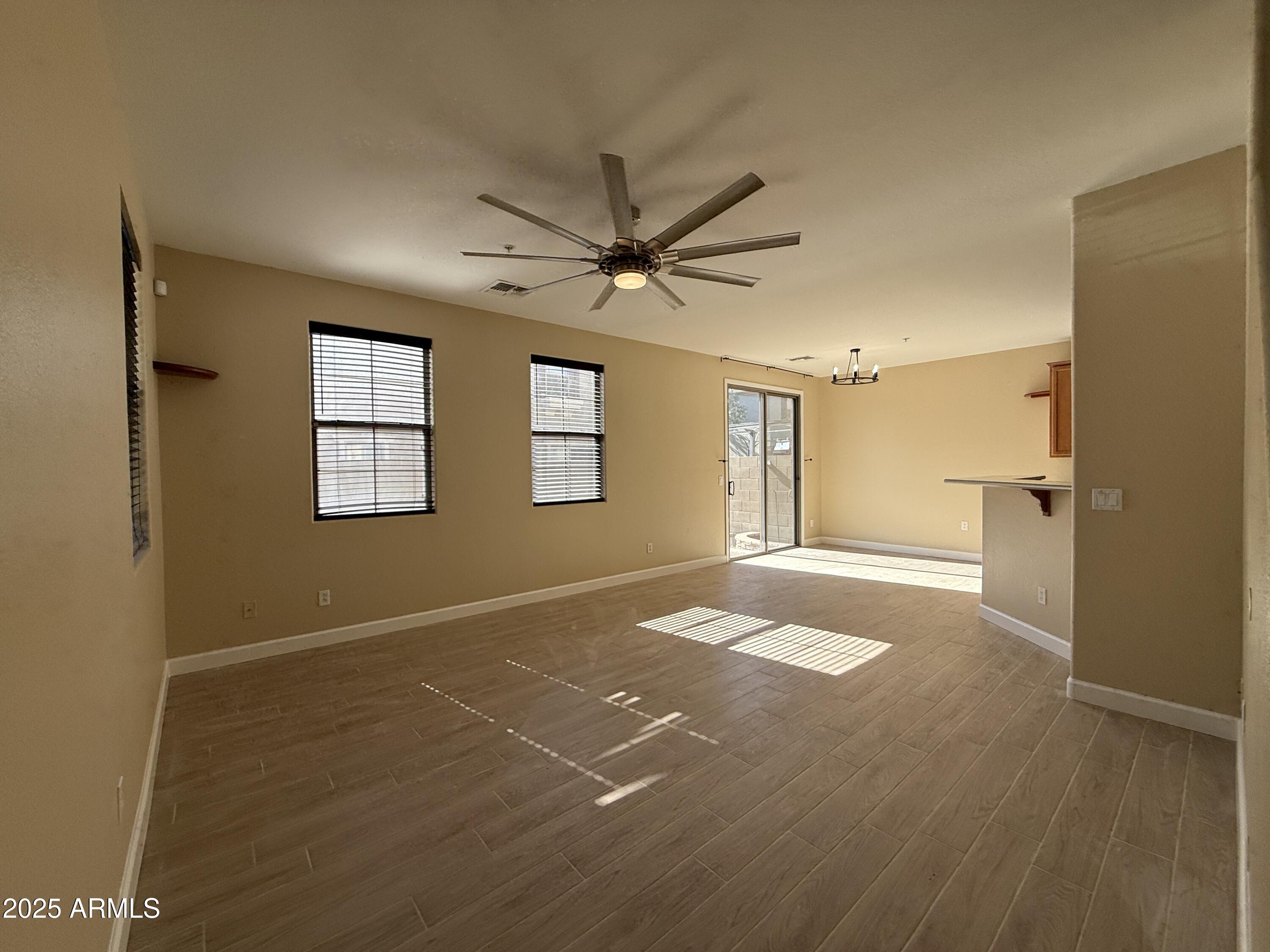 1265 South Aaron, Unit 277 Mesa, AZ 85209 - Photo 9 of 37 a view of an empty room with a window