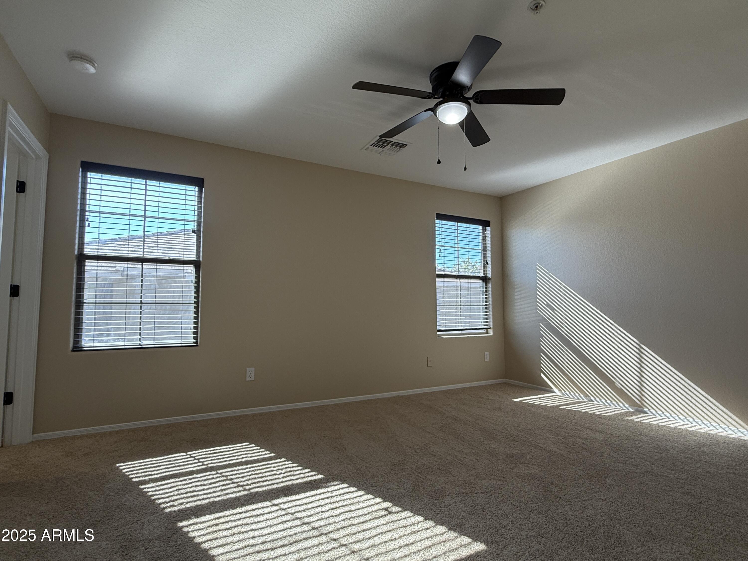 1265 South Aaron, Unit 277 Mesa, AZ 85209 - Photo 10 of 37 a view of an empty room with a window