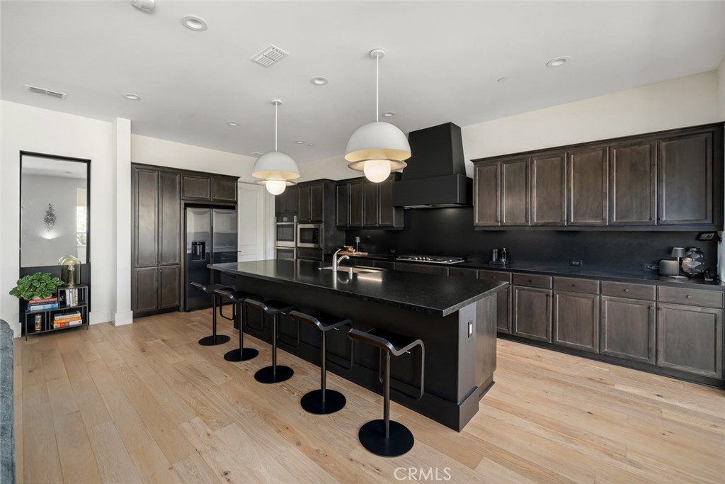 1335 Riley Lane Nipomo, CA 93444 - Photo 17 of 69 a kitchen with a sink cabinets and wooden floor