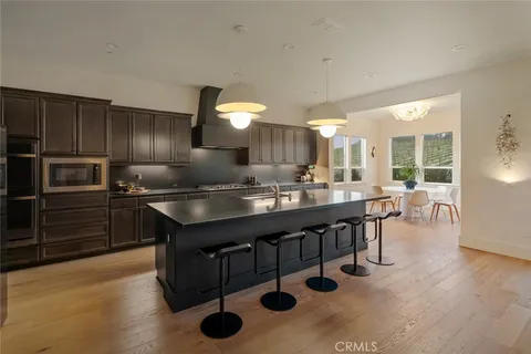 a kitchen with counter top space cabinets and stainless steel appliances