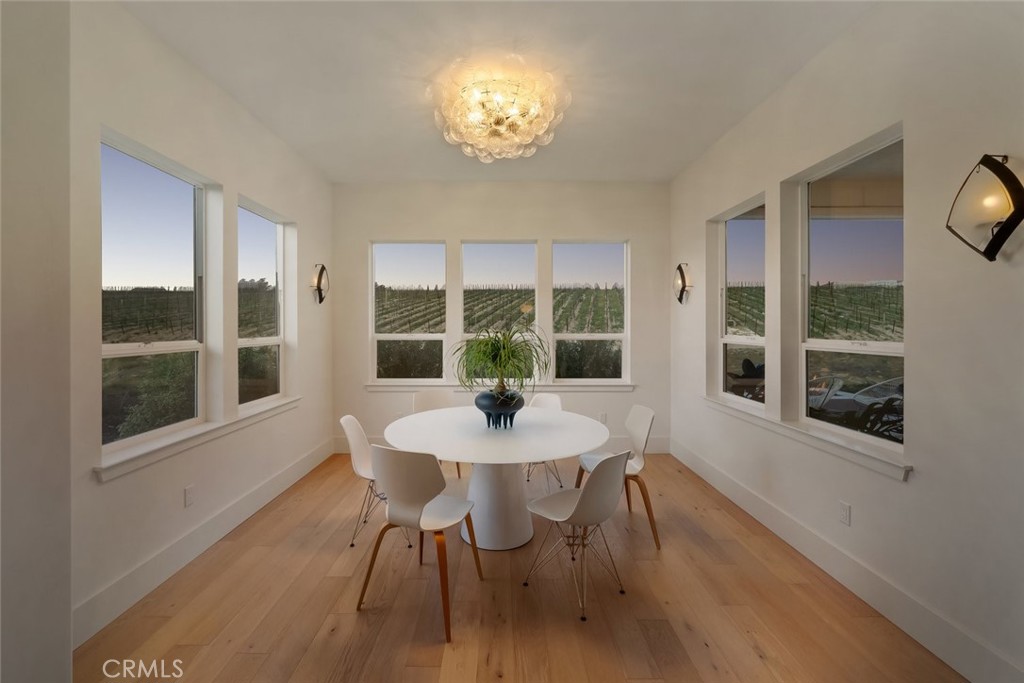 1335 Riley Lane Nipomo, CA 93444 - Photo 25 of 69 a dining room with furniture a chandelier and wooden floor
