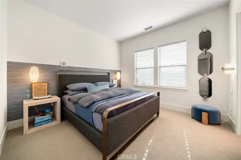 a living room with furniture and a book shelf