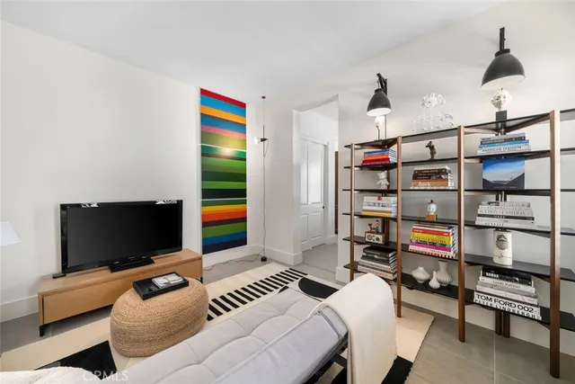 a view of a terrace with furniture and umbrella