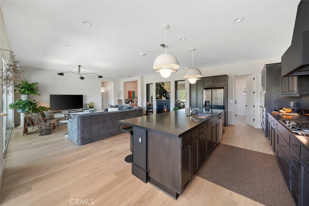 1335 Riley Lane Nipomo, CA 93444 - Photo 28 of 69 a large kitchen with stainless steel appliances kitchen island granite countertop a large counter top and stainless steel appliances