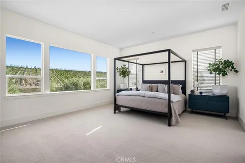 a living room with furniture and a book shelf