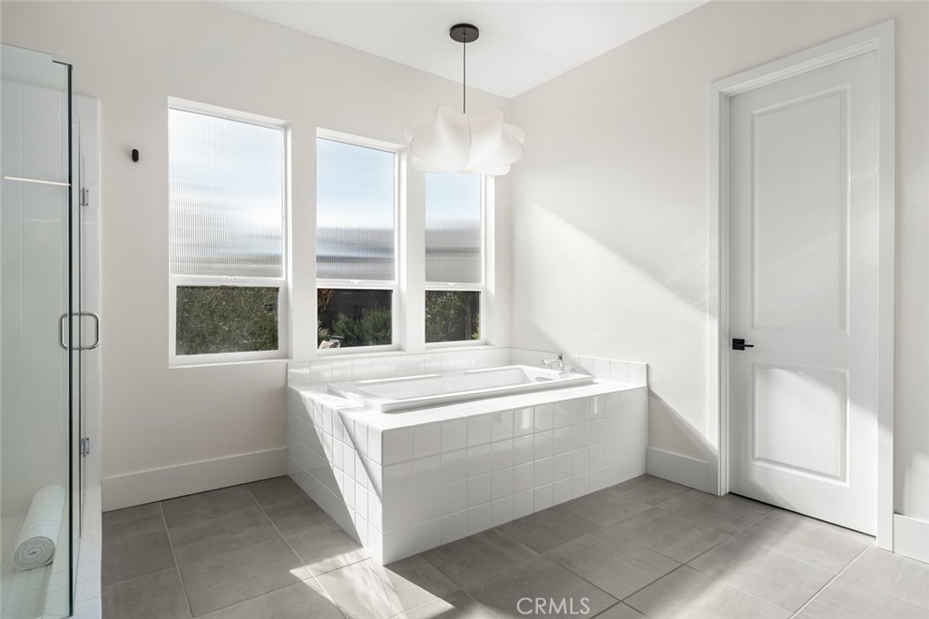 1335 Riley Lane Nipomo, CA 93444 - Photo 32 of 69 a living room with a large window and chandelier