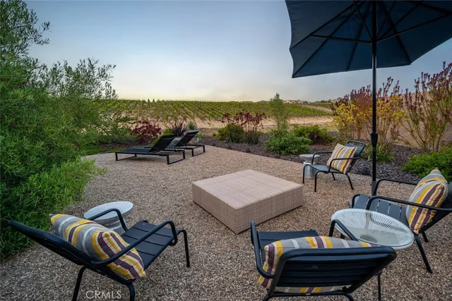 a view of a patio with a table and chairs