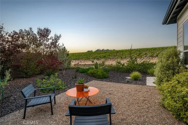 a view of a backyard with sitting area