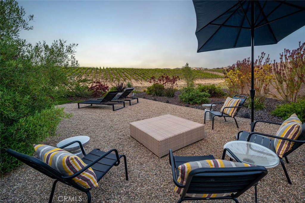 1335 Riley Lane Nipomo, CA 93444 - Photo 44 of 69 a view of a terrace with furniture and umbrella