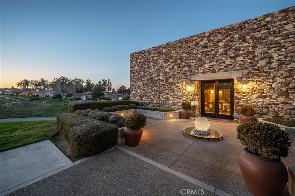 1335 Riley Lane Nipomo, CA 93444 - Photo 56 of 58 a view of a patio with couches table and chairs and potted plants