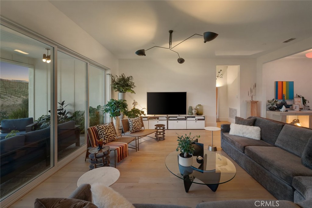 1335 Riley Lane Nipomo, CA 93444 - Photo 8 of 69 a living room with furniture a flat screen tv and a large window