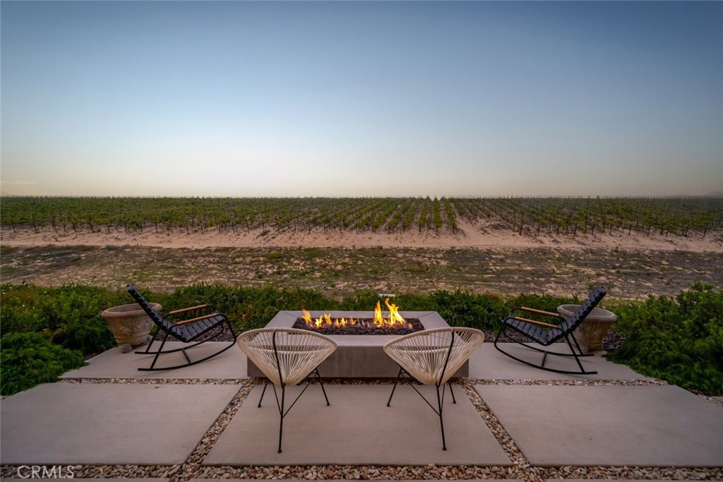 1335 Riley Lane Nipomo, CA 93444 - Photo 10 of 58 a view of a lake with table and chairs