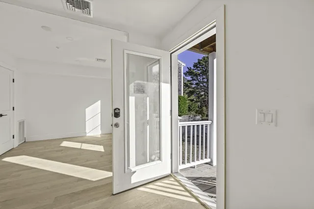 a view of an empty room with a window