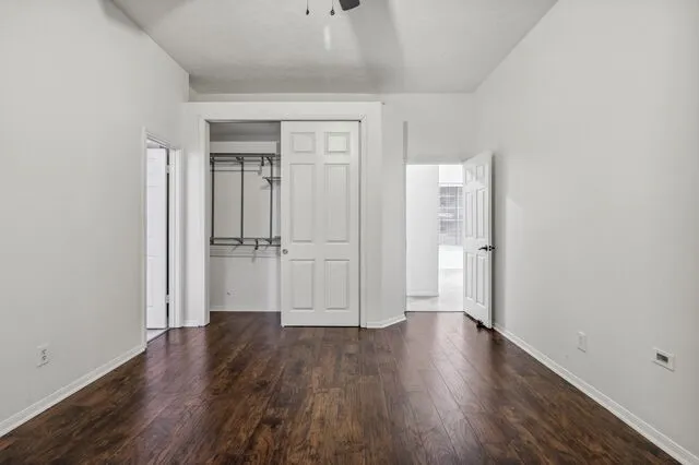 a view of walk in closet with empty racks