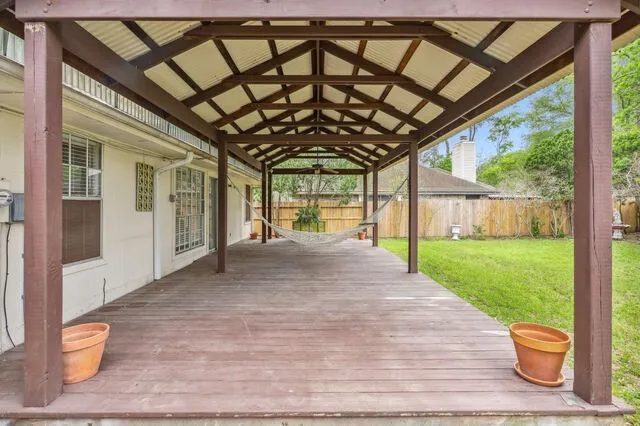 a view of a house with backyard and porch
