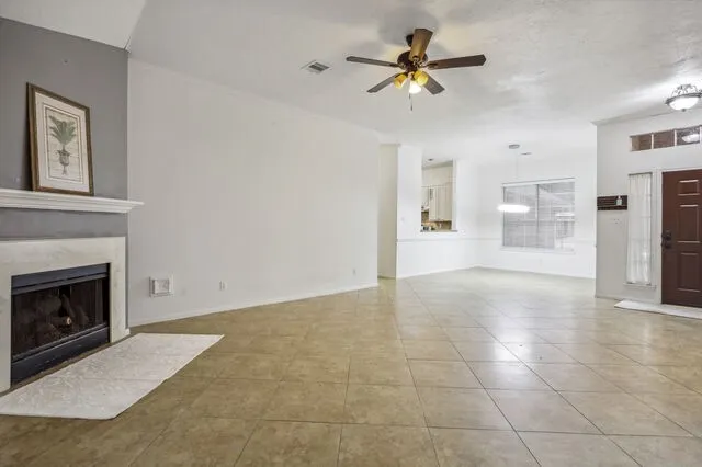 a view of an empty room with a fireplace