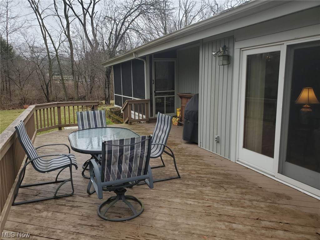 460 Aurora Hudson Road Aurora, OH 44202 - Photo 42 of 44 SPACIOUS DECK CONNECTS TO REAR PORCH